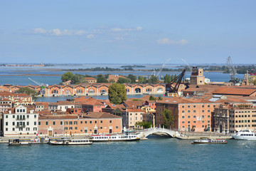 Obraz premium The view from the top of the bellltower of San Giorgio Maggiore church in Venice showing the Arsenale and the Torre di Arsenale 