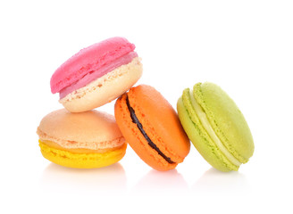 French colorful macarons isolated on a white background