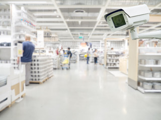 CCTV camera in shopping mall and retail store interior. security camera shopping mall on blurry...