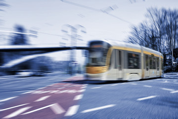 Fototapeta na wymiar Blurred movement of a New type of Brussels tram