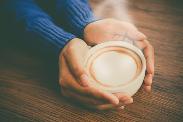 hand hold coffee cup