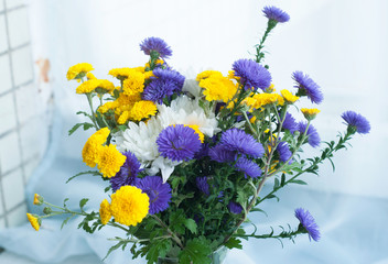 Bouquet of white, yellow and blue chrysanthemums isolated on the white background