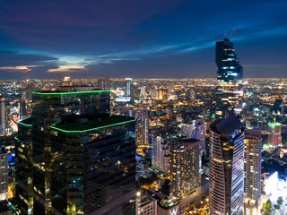 Aerial view of Bangkok new landmark modern office buildings, condominium, living place in Bangkok city downtown with sunset scenery, Bangkok is the most populated city in Southeast Asia.