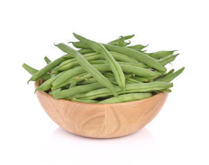 Green beans  in wood bowl on a white background.