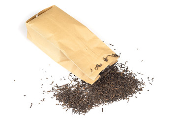 Tea scattered from a package. Isolated on white