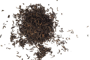 Dry black tea leaves isolated on white