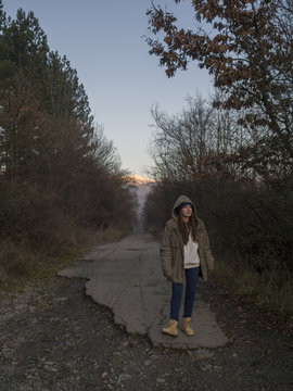 Portrait of soltitary young woman taking a walk outdoors