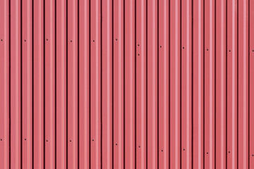 The red color of the metal roof of a country house