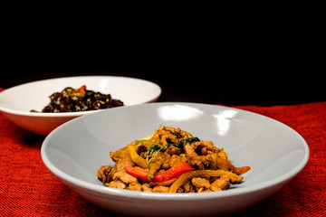 wok fried chicken stir fry with sweet peppers and chinese vegetables