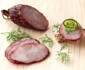 Smoked sausage on a wooden board