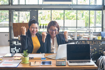 Business women are feeling happy after achieving their goals.