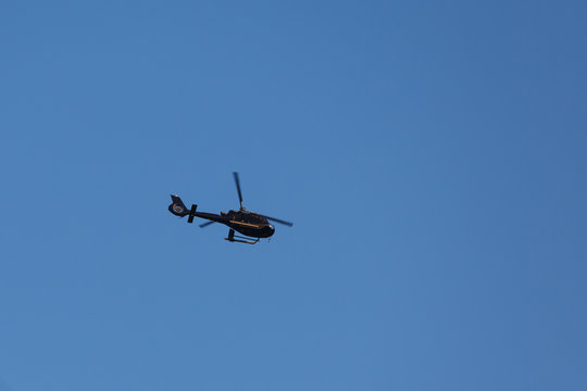 Helicopter in the blue sky