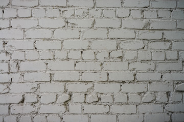 Fototapeta premium The texture of the wall of bricks painted white