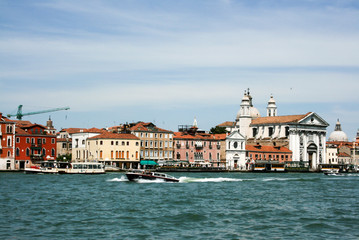 Fototapeta na wymiar Boats and motor boats in the Giudecca Canal in the Italian city of Venice