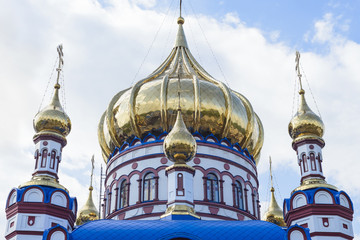 Fototapeta na wymiar Golden domes with crosses and Gold leaf of the Orthodox Church