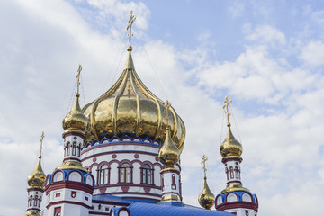 Fototapeta na wymiar Golden domes with crosses and Gold leaf of the Orthodox Church