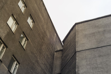 The wall of a factory building with windows