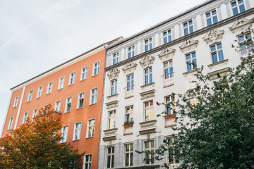 Fototapeta na wymiar orange and white apartment houses in a row