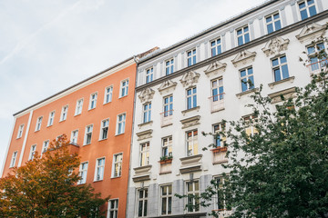 orange and white apartment houses in a row