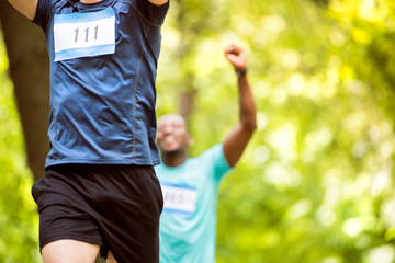 Fototapeta premium Unrecognizable young runners crossing the finish line.