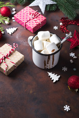Christmas tree branches with Christmas toys and cup of hot cocoa marshmallow