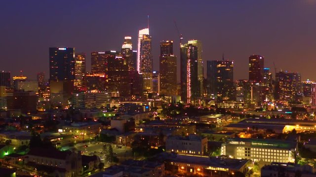 Down Town buildings Los Angeles California Sun set boom up and pull up Aerial view 