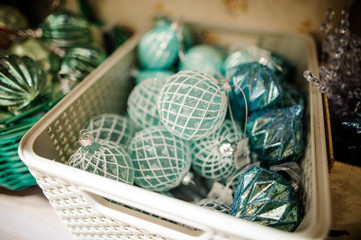 Plastic box with cute and stylish green Christmas tree toys