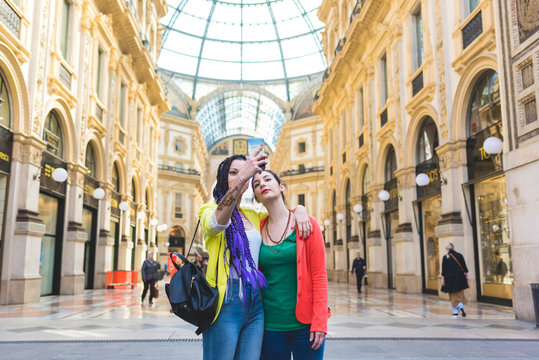 Women taking selfie in the Galleria Vittorio Emanuele II, Milan, Italy