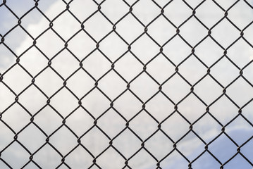 Wire mesh cage with blurry background