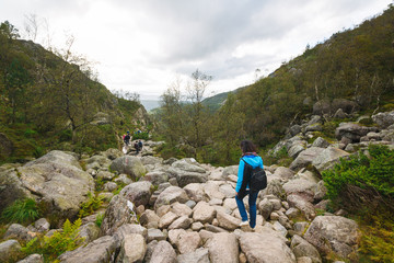 Fototapeta premium Woman is hiking in the mountains in summertime