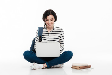 Portrait of a smiling teenage girl with backpack