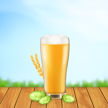 Beer glass with hop plant and wheat