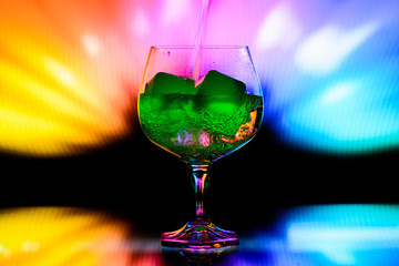 glass with artificial ice on an abstract background