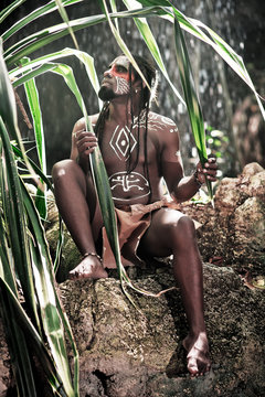 Black Man With Dreadlocks In The Image Of The Taino Indian In Habitat, Body Painting Taino Symbols