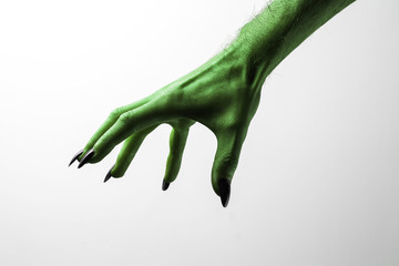 Halloween green witches or zombie monster hand