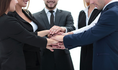 friendly business team with hands clasped together.