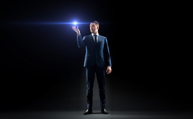 businessman with laser light over black
