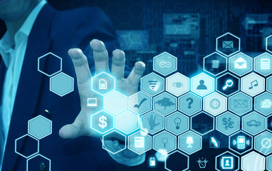 businessman holding technology