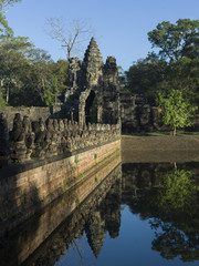 Fototapeta na wymiar Statues at South Gate Bridge and gateway Angkor Thom, Krong Siem Reap, Siem Reap, Cambodia