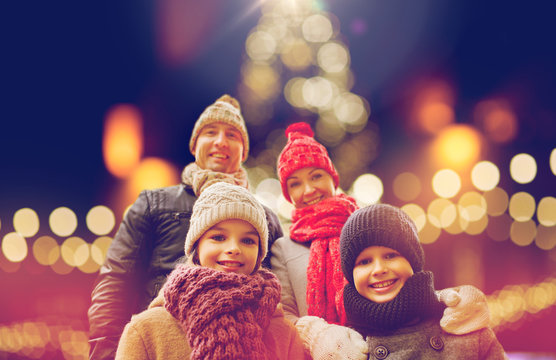 Happy Family Outdoors At Christmas Eve