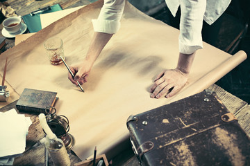 Architect working on drawing table in office