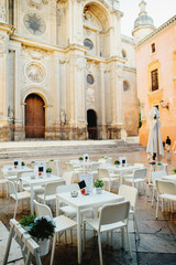 cafe in a square near cathedral in Granada, Spain