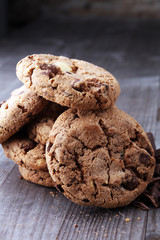 Chocolate cookies on wooden table. Chocolate chip cookies shot.