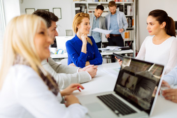 Businesspeople collaborating in office