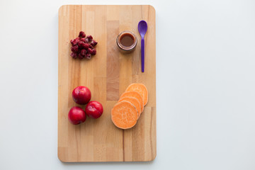 fruit puree or baby food in jar and feeding spoon