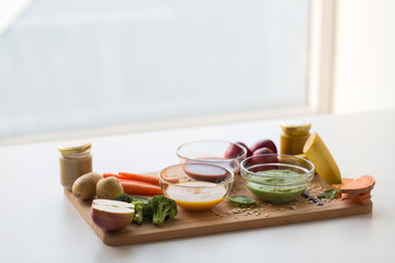 vegetable puree or baby food in glass bowls
