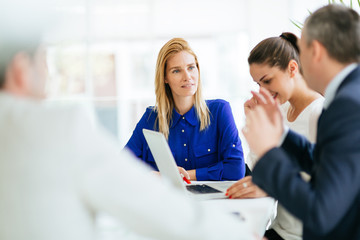 Businesspeople collaborating in office