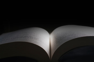 Open book, black background