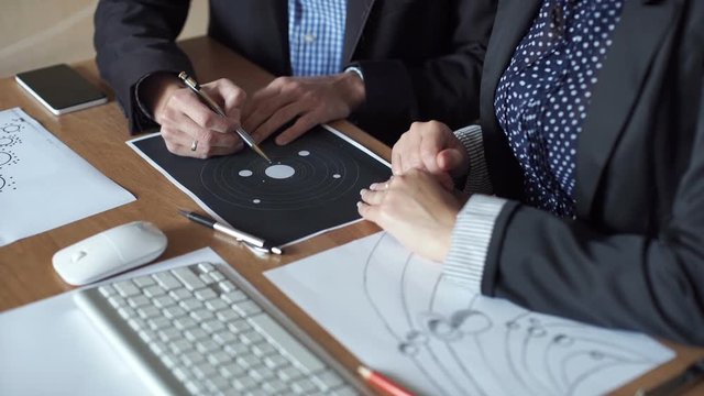 A team of engineers discussing a flight into space