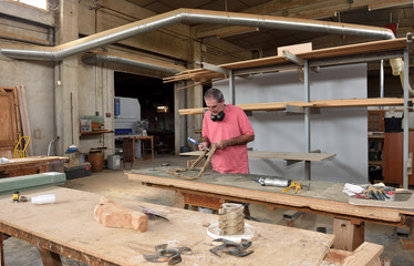 a naked brunette woman who is in bed